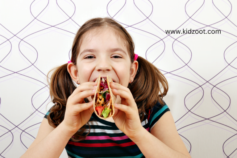 girl eating tacos